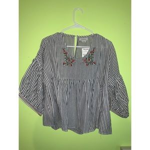 striped top with embroidered flowers